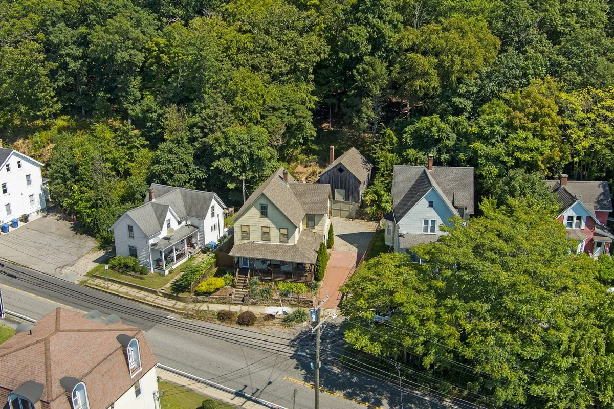An aerial view of a house with a porch on Laurel Hill Road in Norwich, bought by Next Door Properties