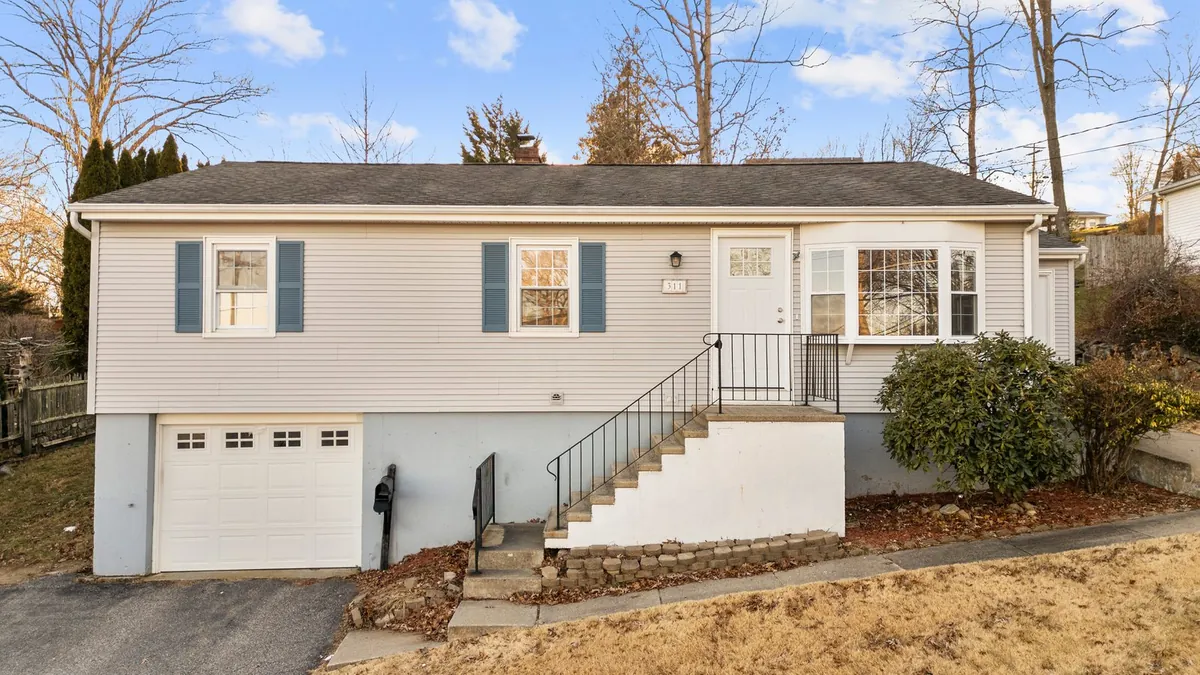 A grey raised ranch on Colonial Street in Watertown, bought by Next Door Properties